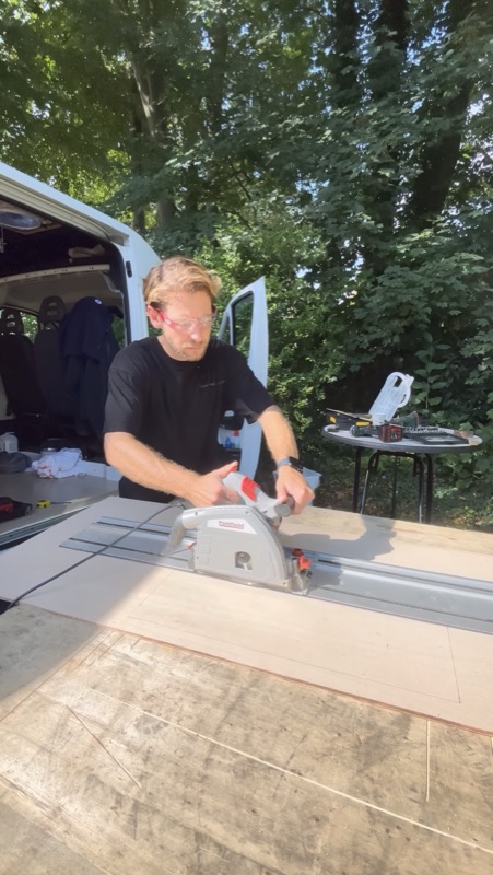 Arthur cutting plywood for the build, every board adds weight